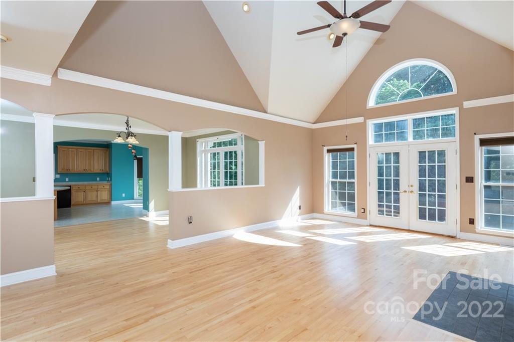 323 Ferguson Ridge Road Clover, SC 29710 - Photo 11 of 47 a view of an empty room with a window and wooden floor