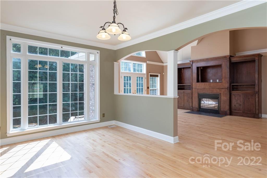 323 Ferguson Ridge Road Clover, SC 29710 - Photo 16 of 47 a view of empty room with a fireplace and wooden floor
