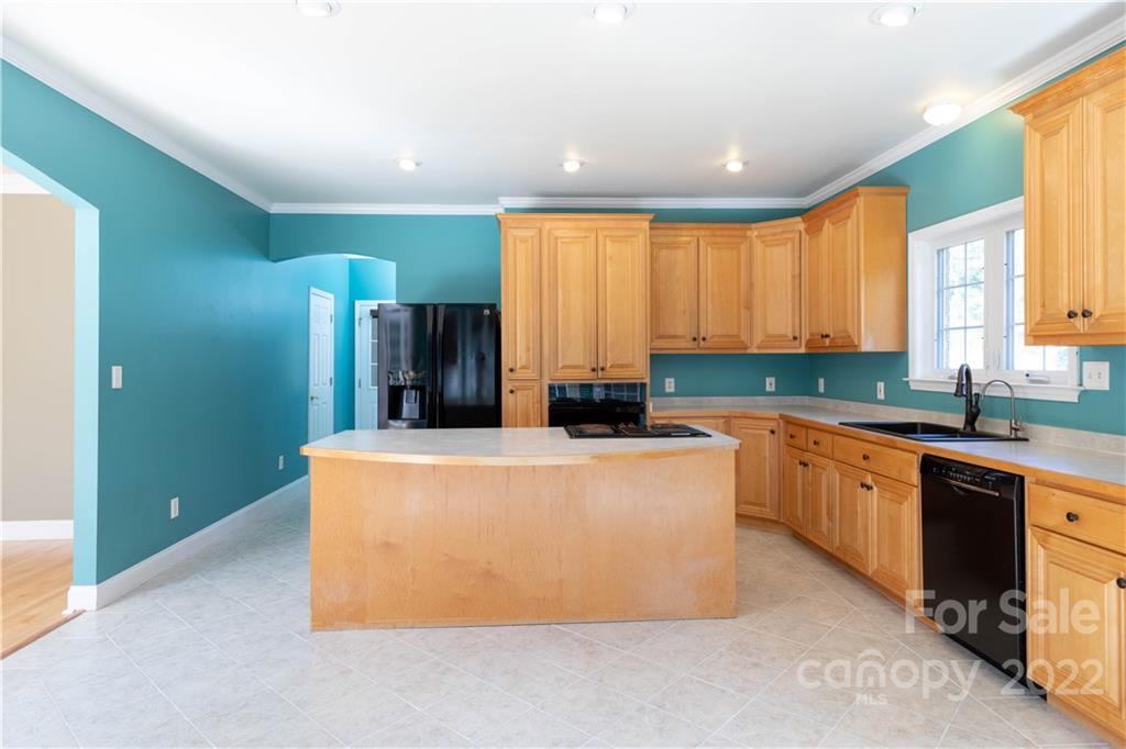 323 Ferguson Ridge Road Clover, SC 29710 - Photo 18 of 47 a large kitchen with stainless steel appliances granite countertop a stove a refrigerator a sink and a microwave