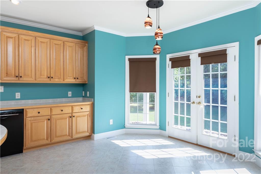 323 Ferguson Ridge Road Clover, SC 29710 - Photo 19 of 47 a view of a kitchen with granite countertop cabinets and a ceiling fan