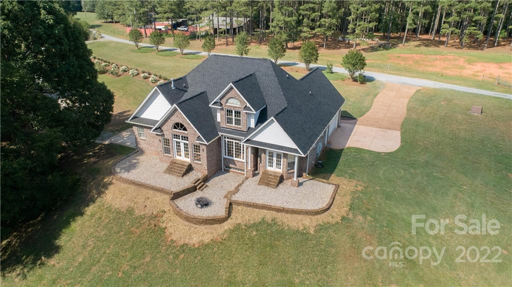 323 Ferguson Ridge Road Clover, SC 29710 - Photo 2 of 47 an aerial view of a house with swimming pool and ocean view