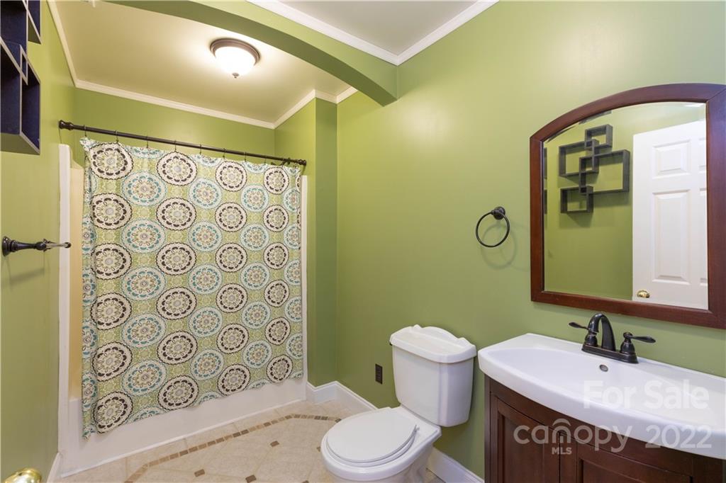 323 Ferguson Ridge Road Clover, SC 29710 - Photo 31 of 47 a bathroom with a sink and a mirror