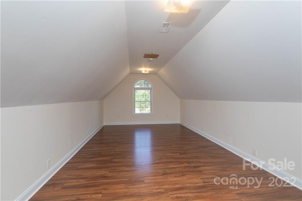 323 Ferguson Ridge Road Clover, SC 29710 - Photo 32 of 47 an empty room with wooden floor and windows