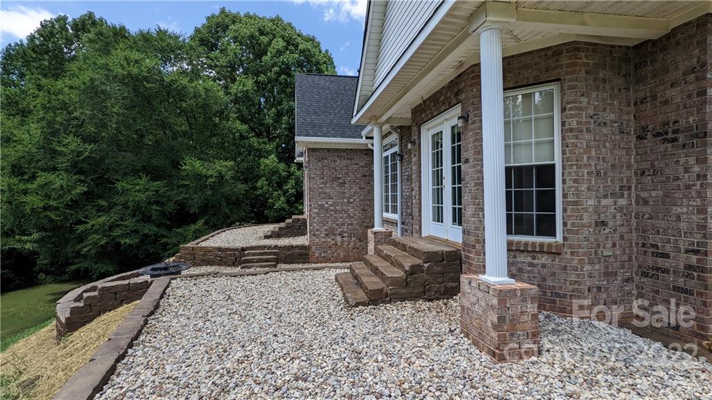 323 Ferguson Ridge Road Clover, SC 29710 - Photo 35 of 47 a front view of a house with garden