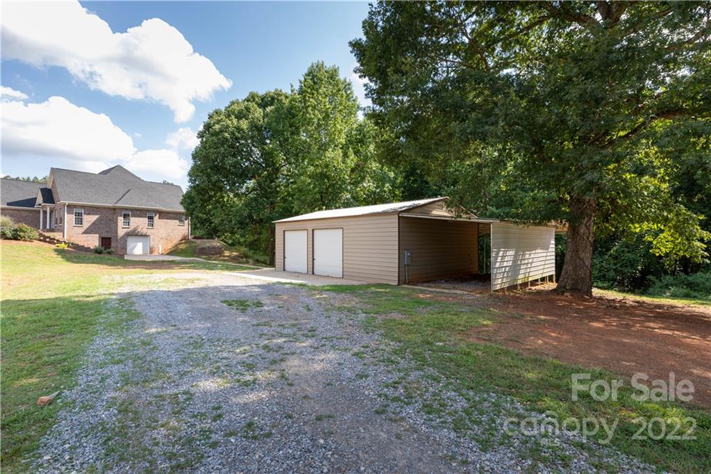 323 Ferguson Ridge Road Clover, SC 29710 - Photo 40 of 47 a view of a house with backyard and a tree
