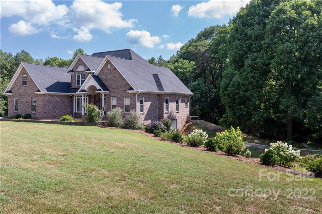 323 Ferguson Ridge Road Clover, SC 29710 - Photo 45 of 47 a front view of a house with a garden