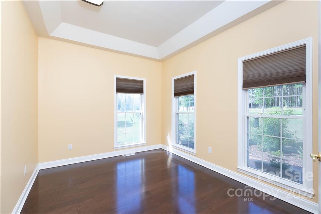 323 Ferguson Ridge Road Clover, SC 29710 - Photo 8 of 47 a view of an empty room with wooden floor and windows