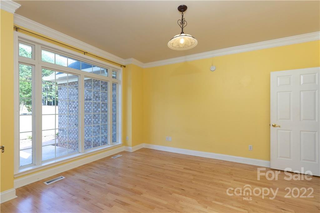 323 Ferguson Ridge Road Clover, SC 29710 - Photo 9 of 47 a view of an empty room with wooden floor and a window