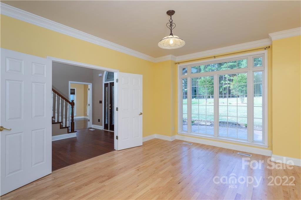 323 Ferguson Ridge Road Clover, SC 29710 - Photo 10 of 47 a view of empty room with wooden floor and fan