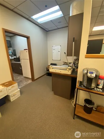 a room with a sink and cabinets