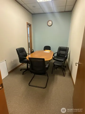 a room with a chair and wooden floor