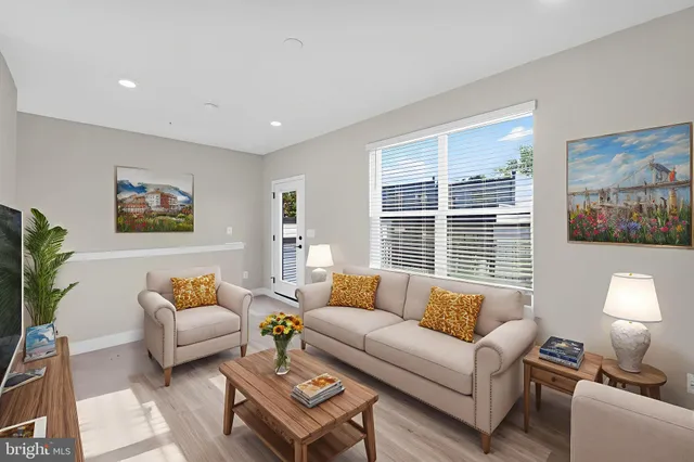 a living room with furniture and a large window