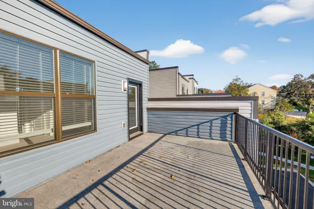 a view of a balcony with wooden floor