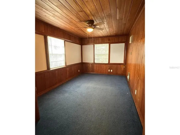 en empty room with windows