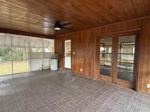 a view of large trees with backyard
