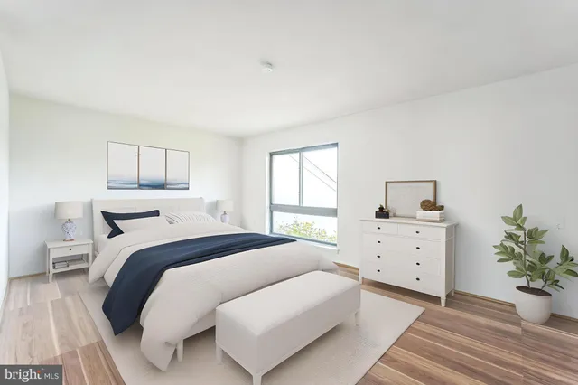 a bed room with a bed and a window