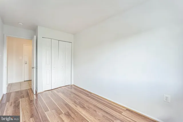 a view of room with wooden floor