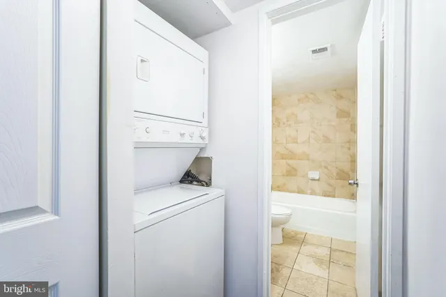 a bathroom with a toilet a sink and a shower