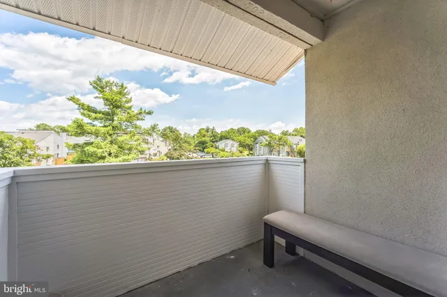a view of a balcony with chair