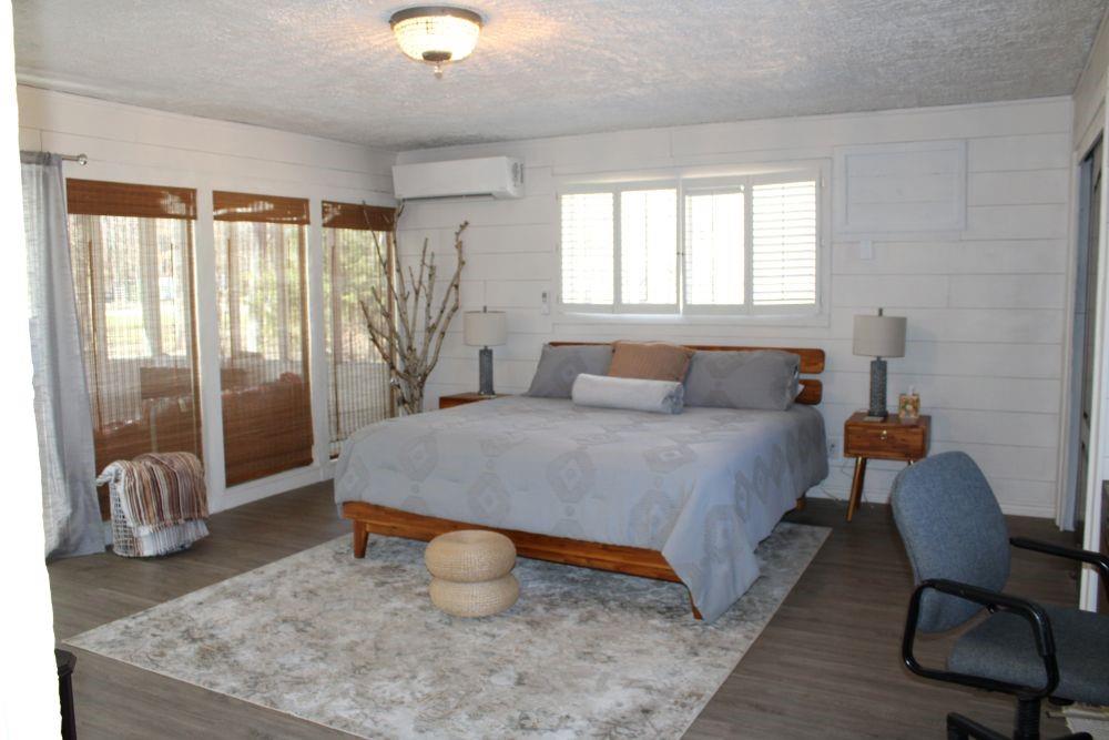 2629 Fox Point Road Quinlan, TX 75474 - Photo 14 of 30 a bedroom with a bed and glass door