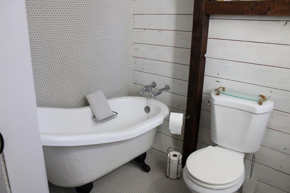 2629 Fox Point Road Quinlan, TX 75474 - Photo 16 of 30 a white toilet sitting next to a bathroom sink