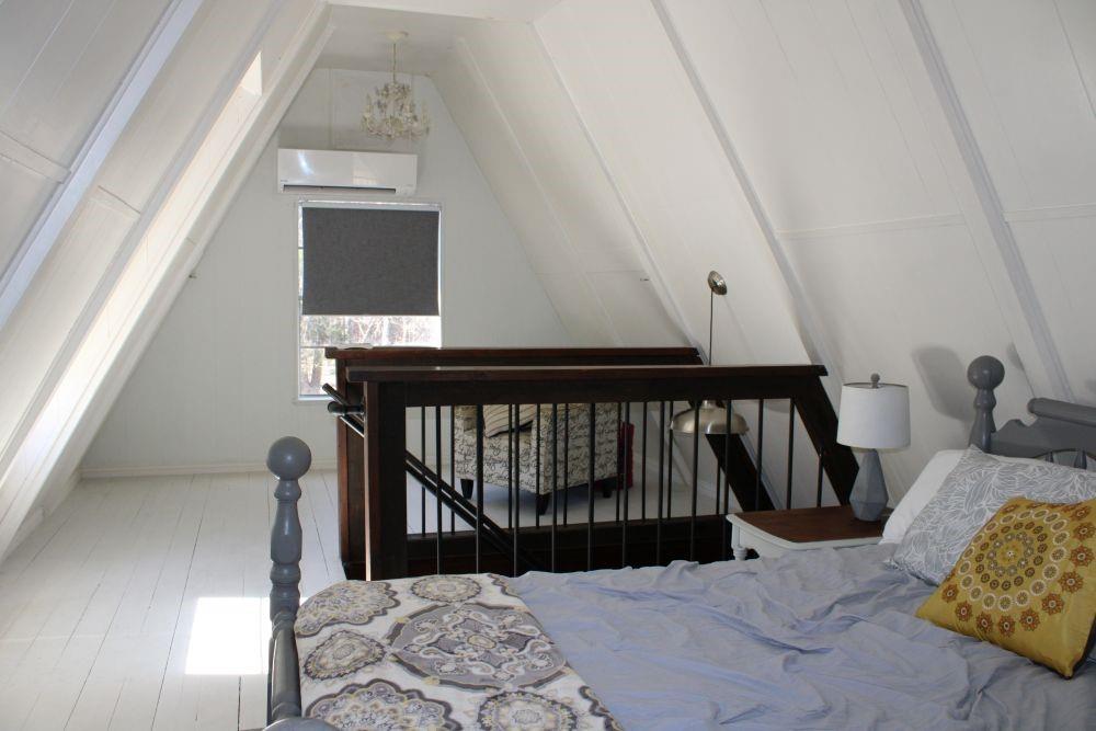 2629 Fox Point Road Quinlan, TX 75474 - Photo 20 of 30 a bedroom with bed and a window