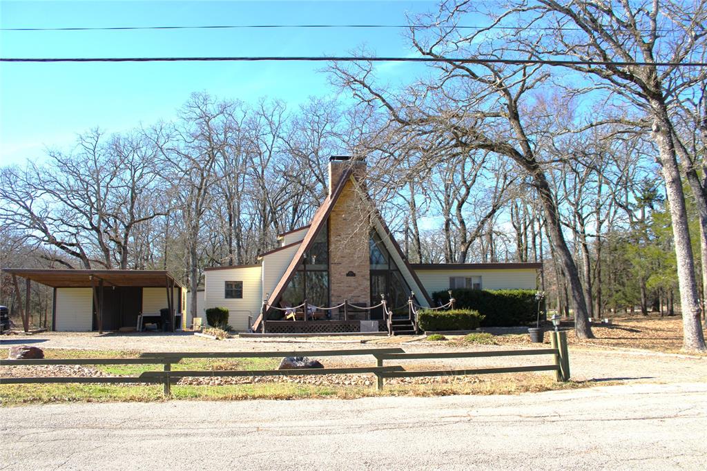 2629 Fox Point Road Quinlan, TX 75474 - Photo 2 of 30 a view of a house with a yard