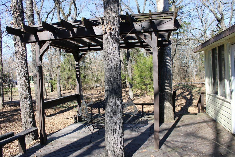 2629 Fox Point Road Quinlan, TX 75474 - Photo 28 of 30 a view of a porch with furniture and yard