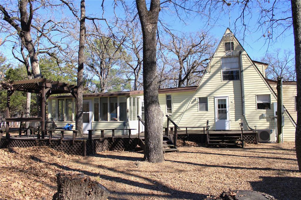 2629 Fox Point Road Quinlan, TX 75474 - Photo 5 of 30 a front view of a house with street