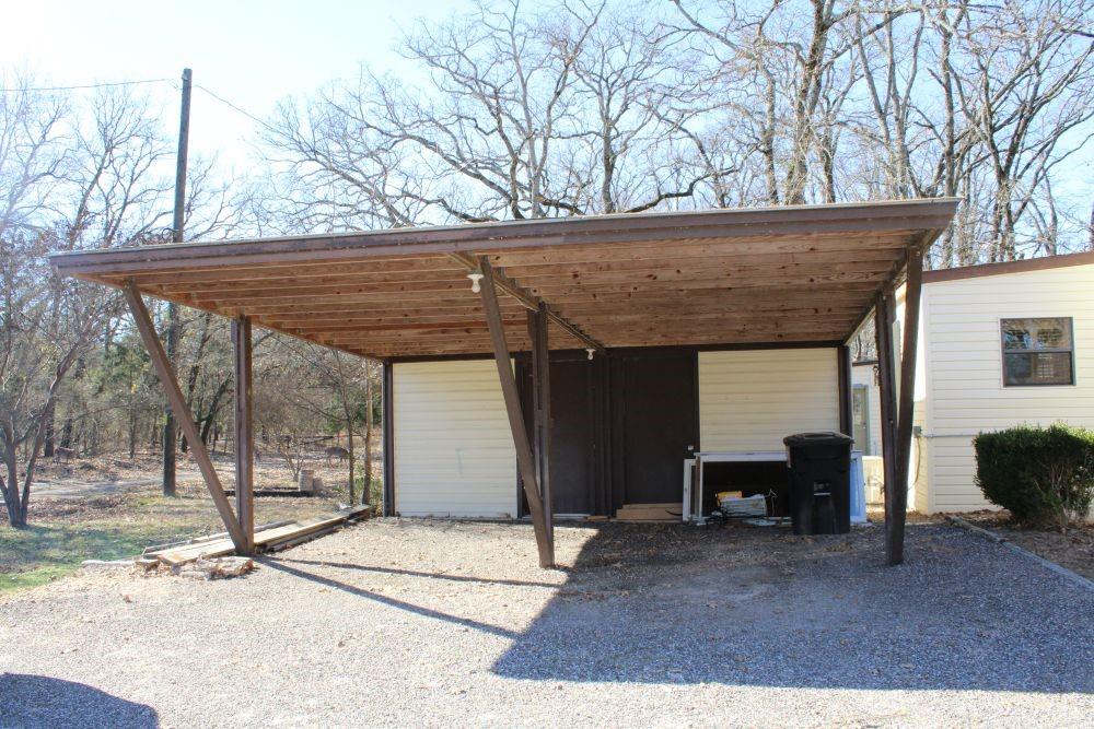 2629 Fox Point Road Quinlan, TX 75474 - Photo 6 of 30 a view of a house with a patio