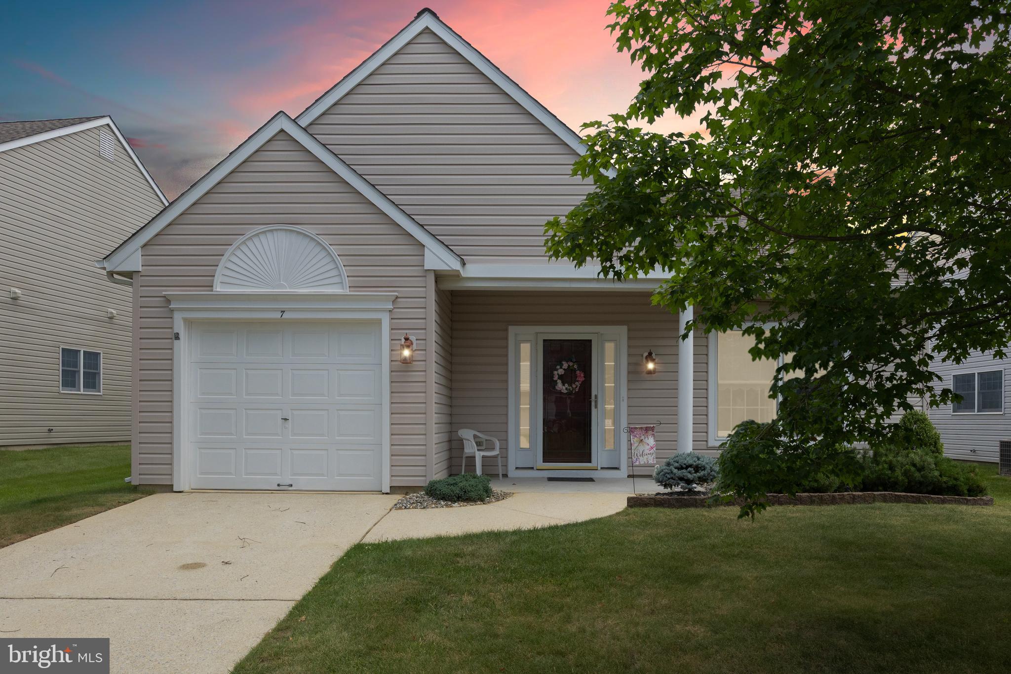 front view of a house and a yard
