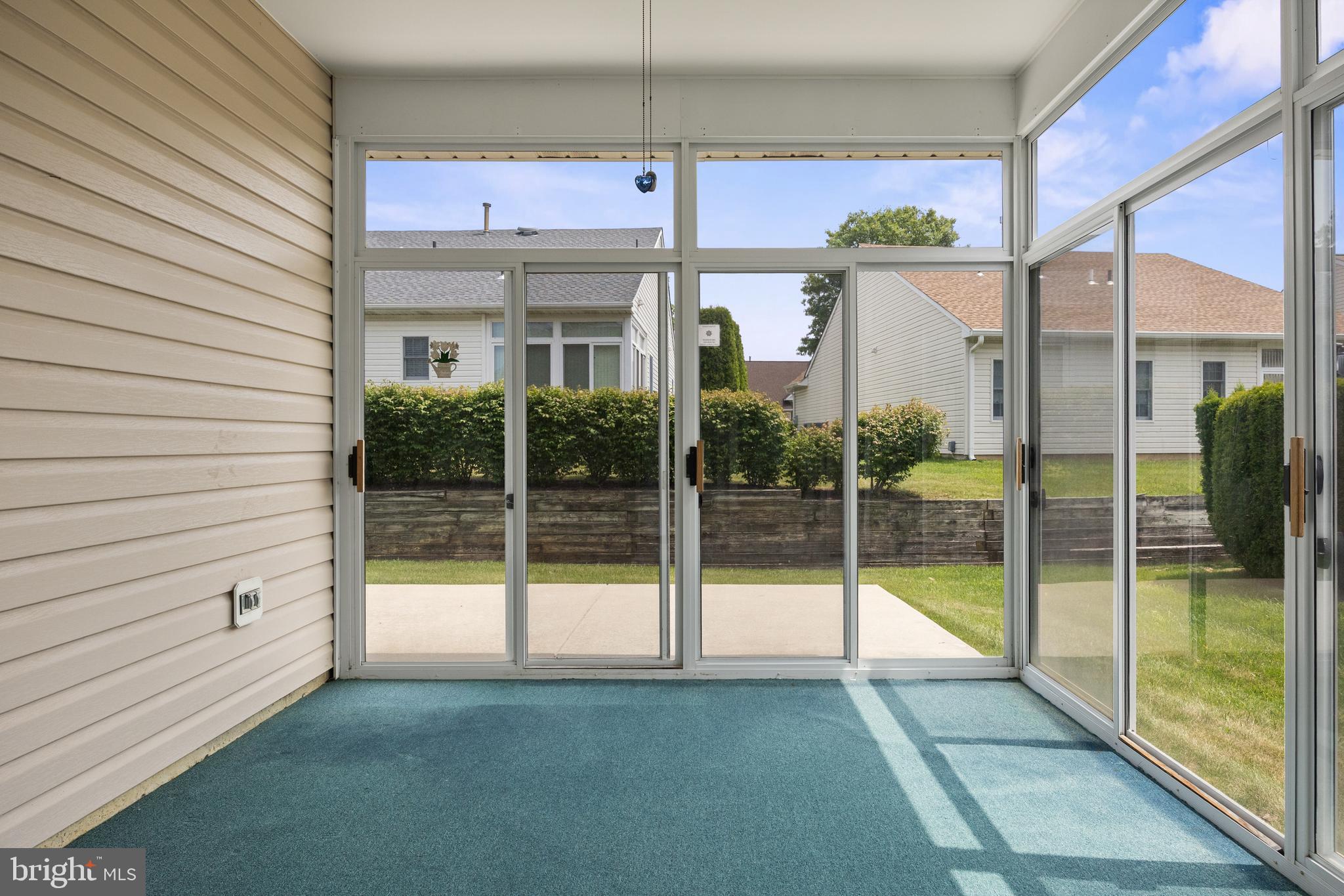 7 Covered Bridge Circle Columbus, NJ 08022 - Photo 16 of 40 a view of a house with a floor to ceiling window and wooden floor