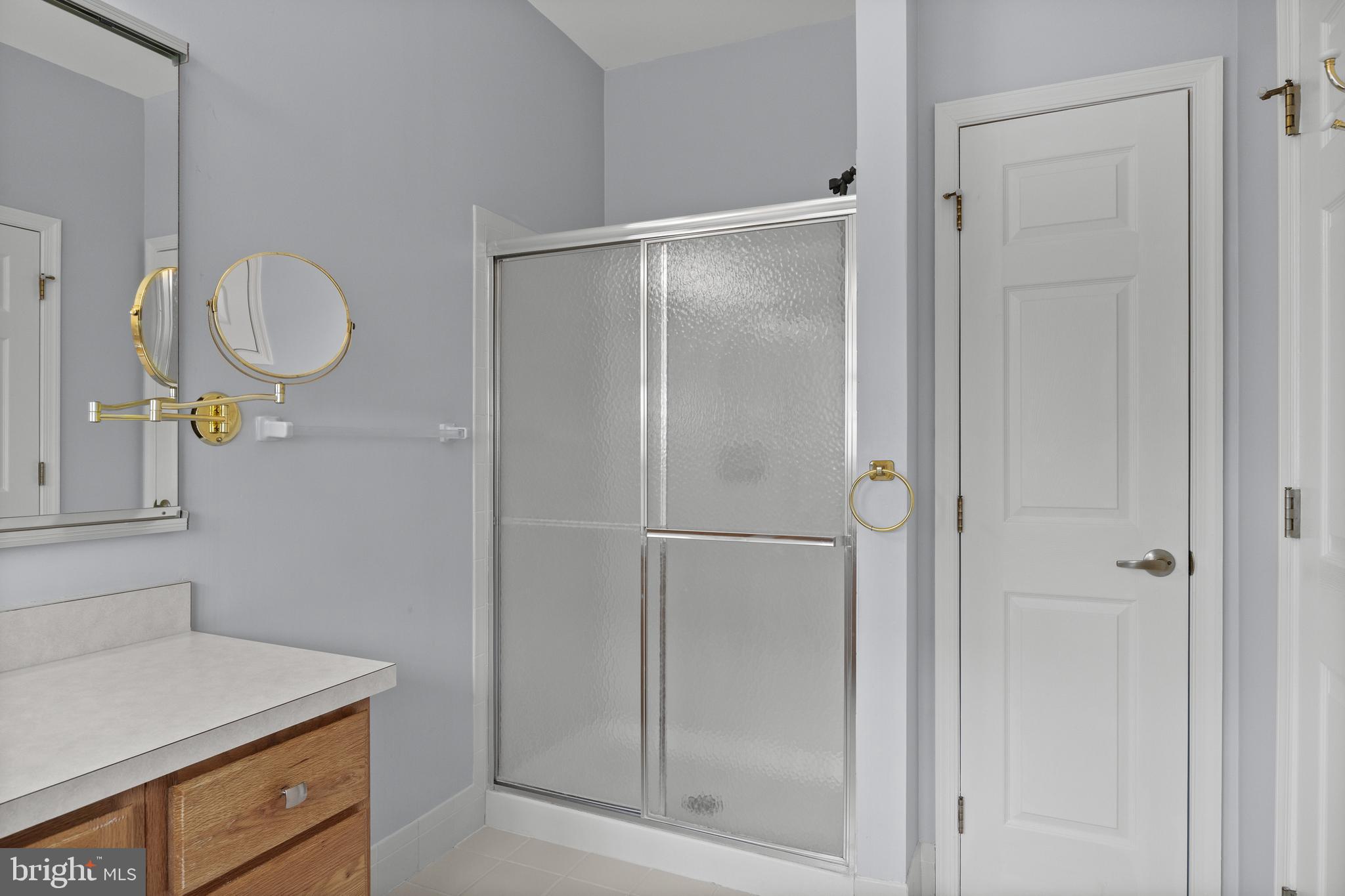 7 Covered Bridge Circle Columbus, NJ 08022 - Photo 21 of 40 a bathroom with a shower sink and mirror