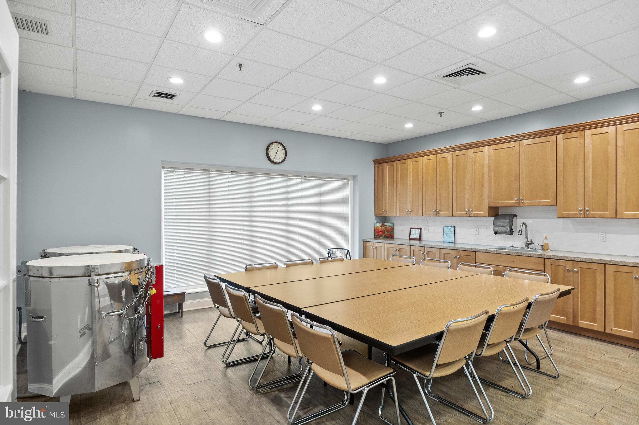 7 Covered Bridge Circle Columbus, NJ 08022 - Photo 33 of 40 a kitchen with a table chairs sink and cabinets