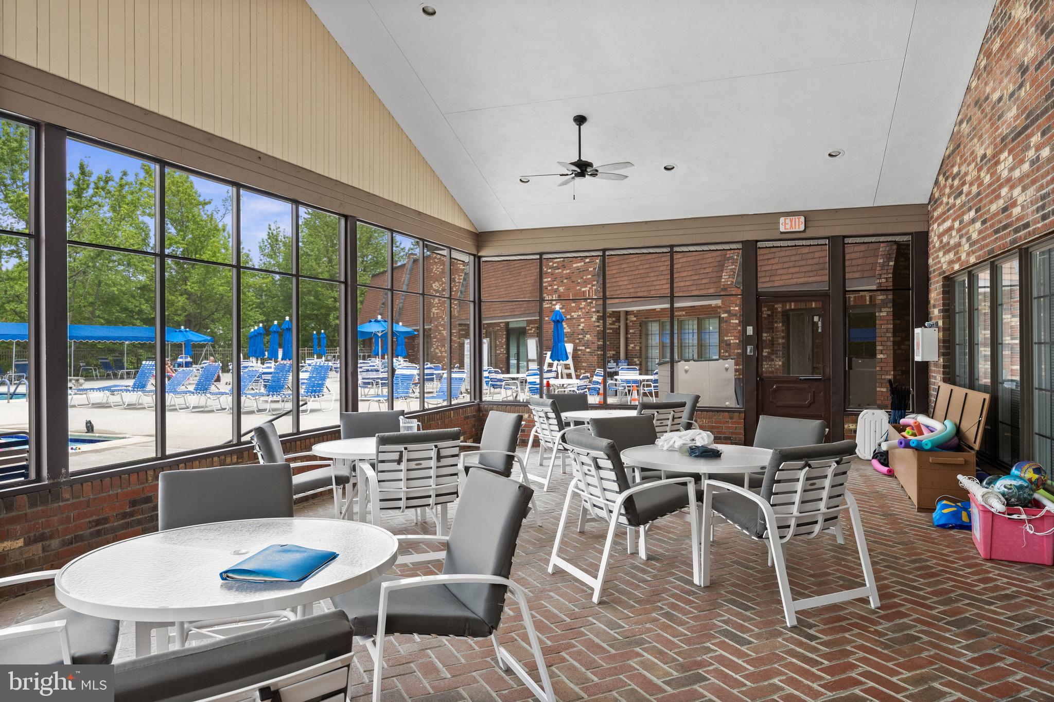 7 Covered Bridge Circle Columbus, NJ 08022 - Photo 35 of 40 a room with lots of tables a large window and chairs