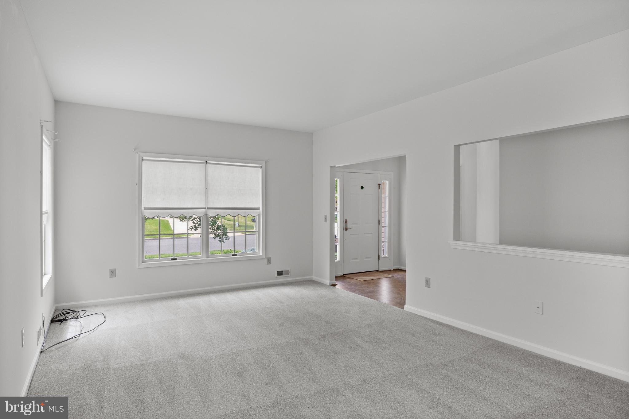 7 Covered Bridge Circle Columbus, NJ 08022 - Photo 7 of 40 an empty room with a empty space and windows
