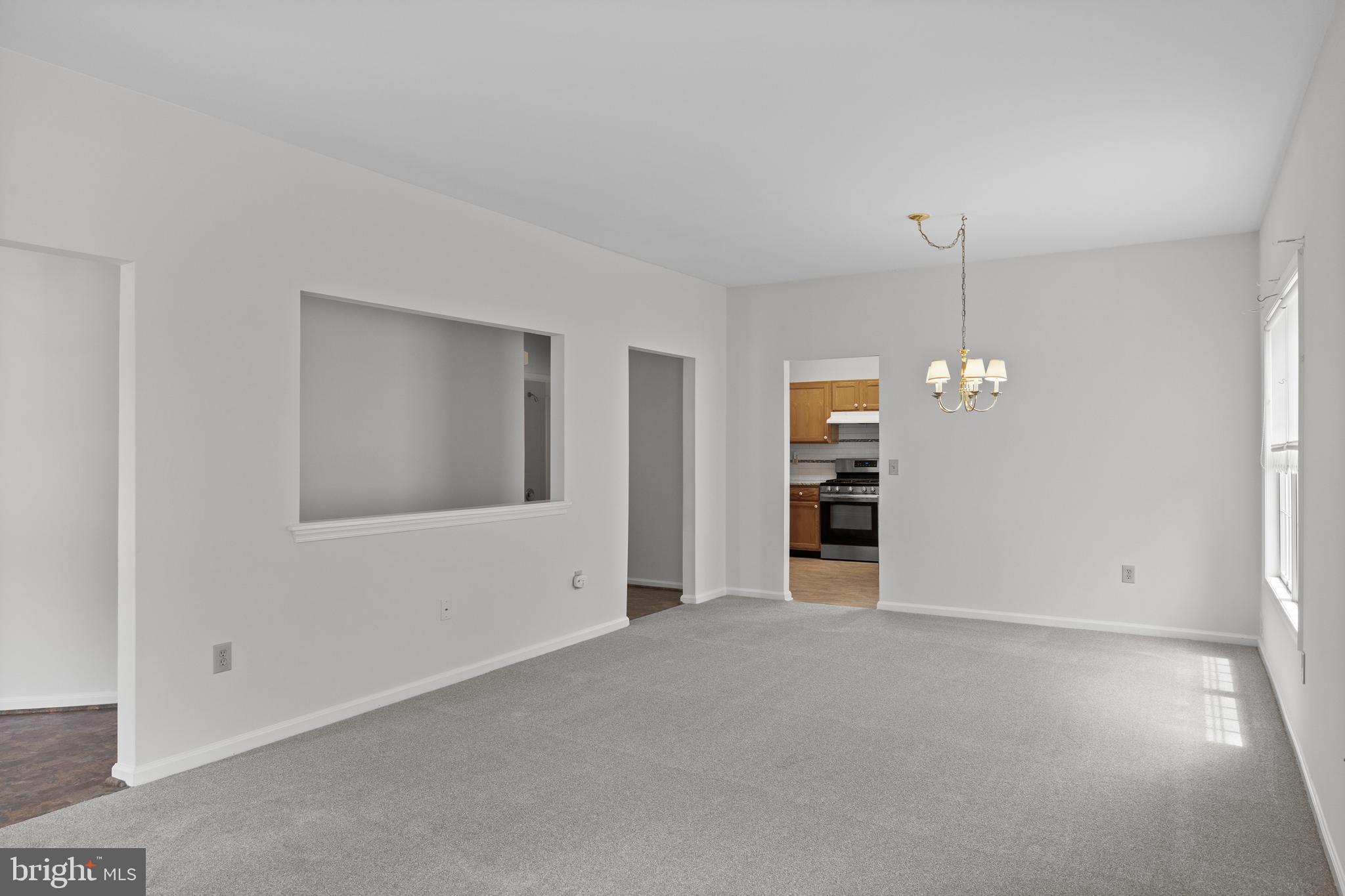 7 Covered Bridge Circle Columbus, NJ 08022 - Photo 8 of 40 an empty room with a empty space and a ceiling fan