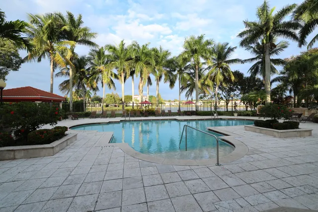 a view of a swimming pool and lounge chair