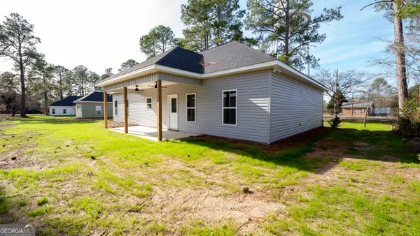 a house with trees in front of it