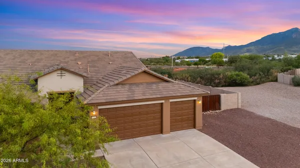 a aerial view of a house with a yard