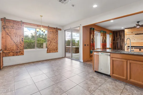 a kitchen with stainless steel appliances a refrigerator and a stove top oven