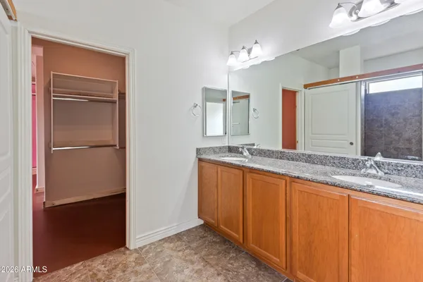 a view of a room with wooden floor and a cabinet
