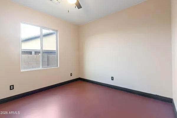 a living room with furniture a flat screen tv and kitchen view