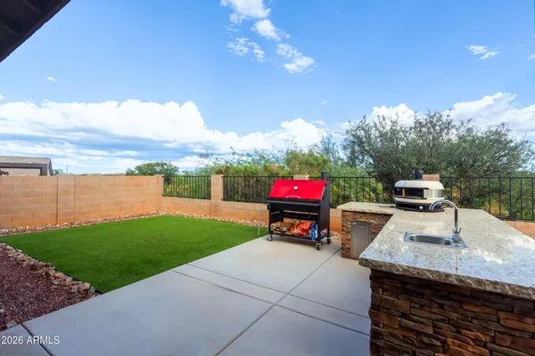a view of an house with backyard porch and furniture