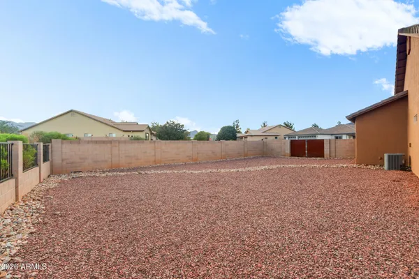 an aerial view of a house with outdoor space
