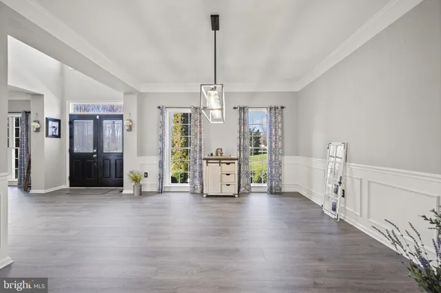 a kitchen with cabinets appliances a sink and a window