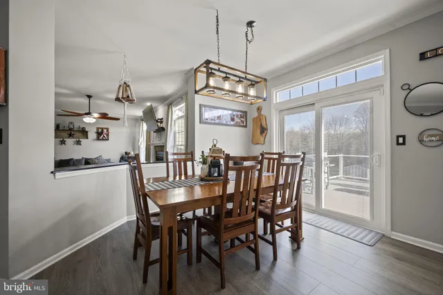 a living room with furniture a rug and a large window