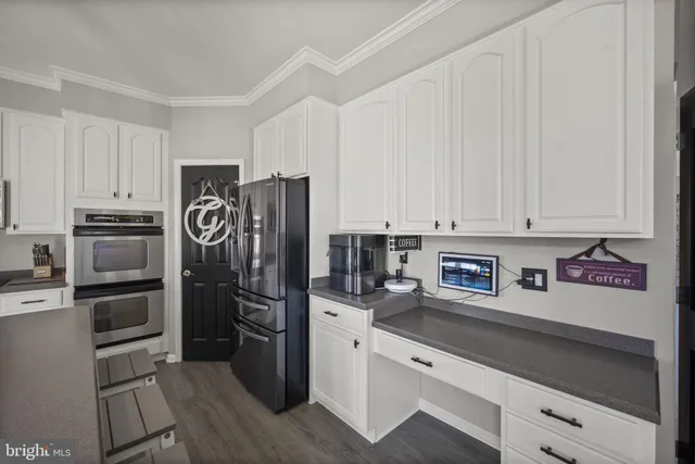 a spacious bedroom with a bed a window and closet