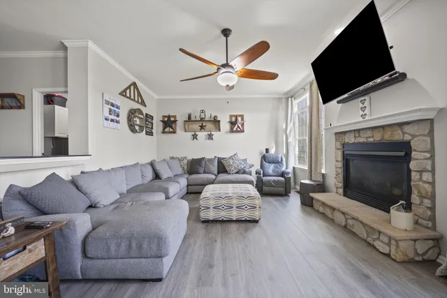 a spacious bedroom with a bed and a flat screen tv