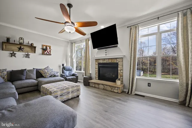 a spacious bedroom with a bed and a flat screen tv